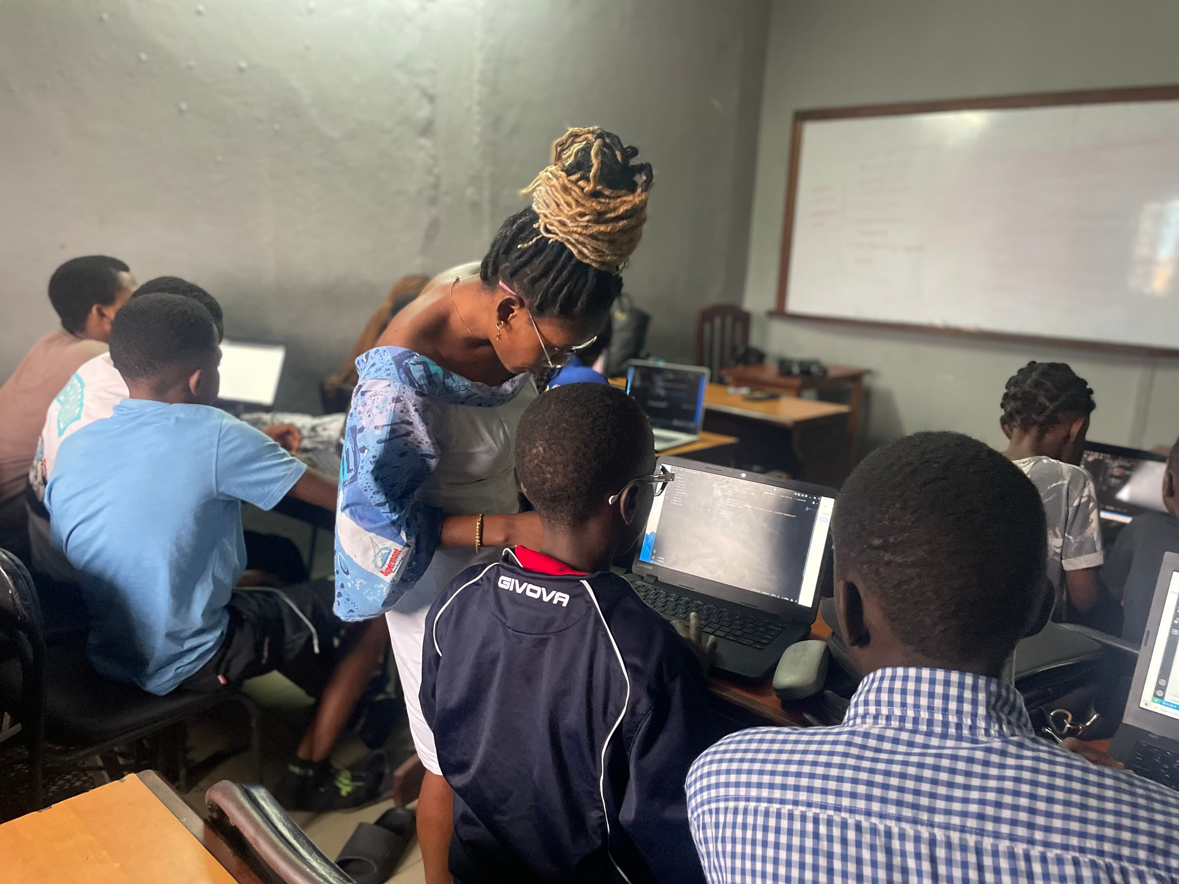 Students focused on coding work during a Giiyo Tech session
