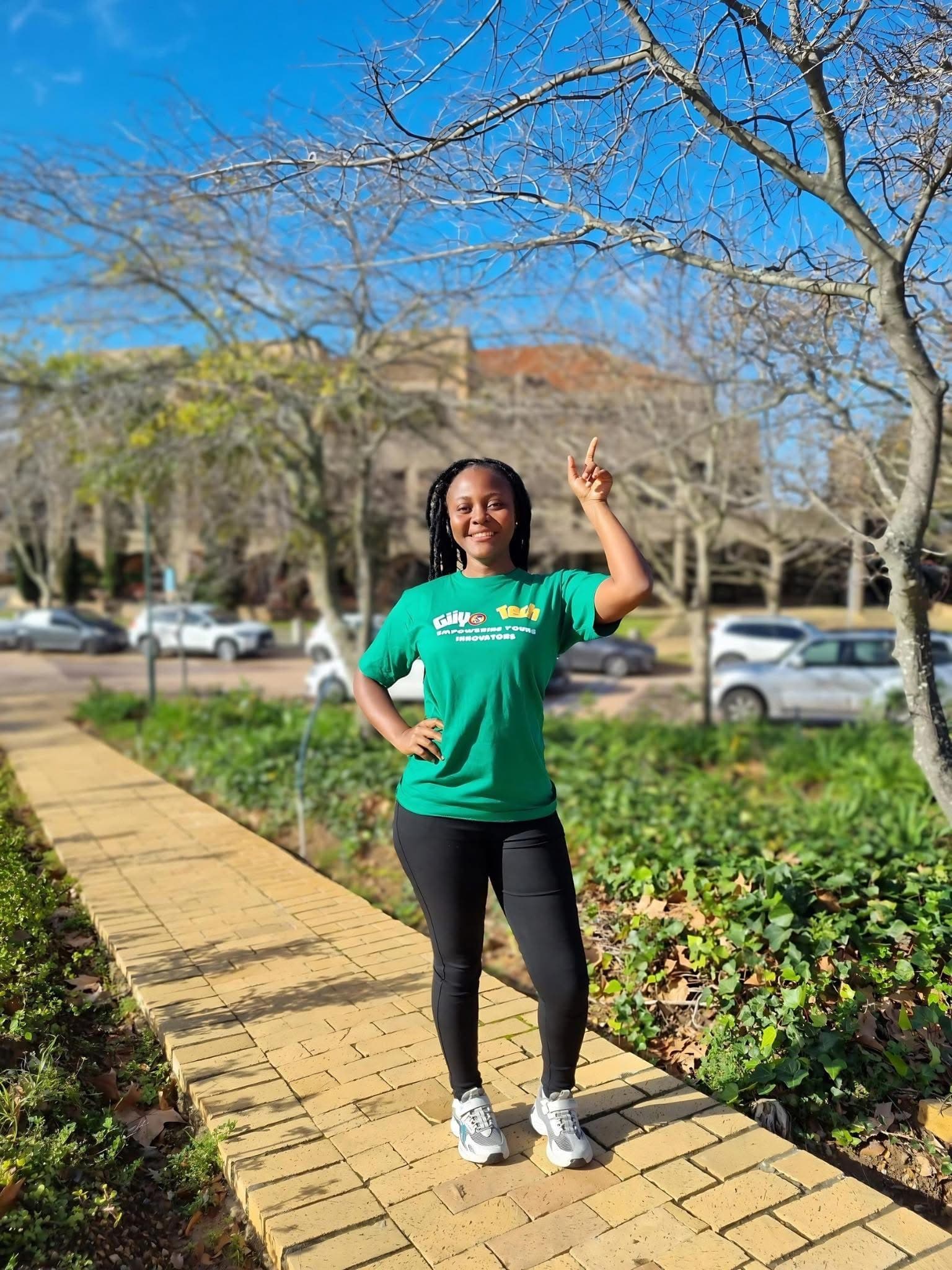 Giiyo Tech founder Maureen pointing toward the organization's mission and impact