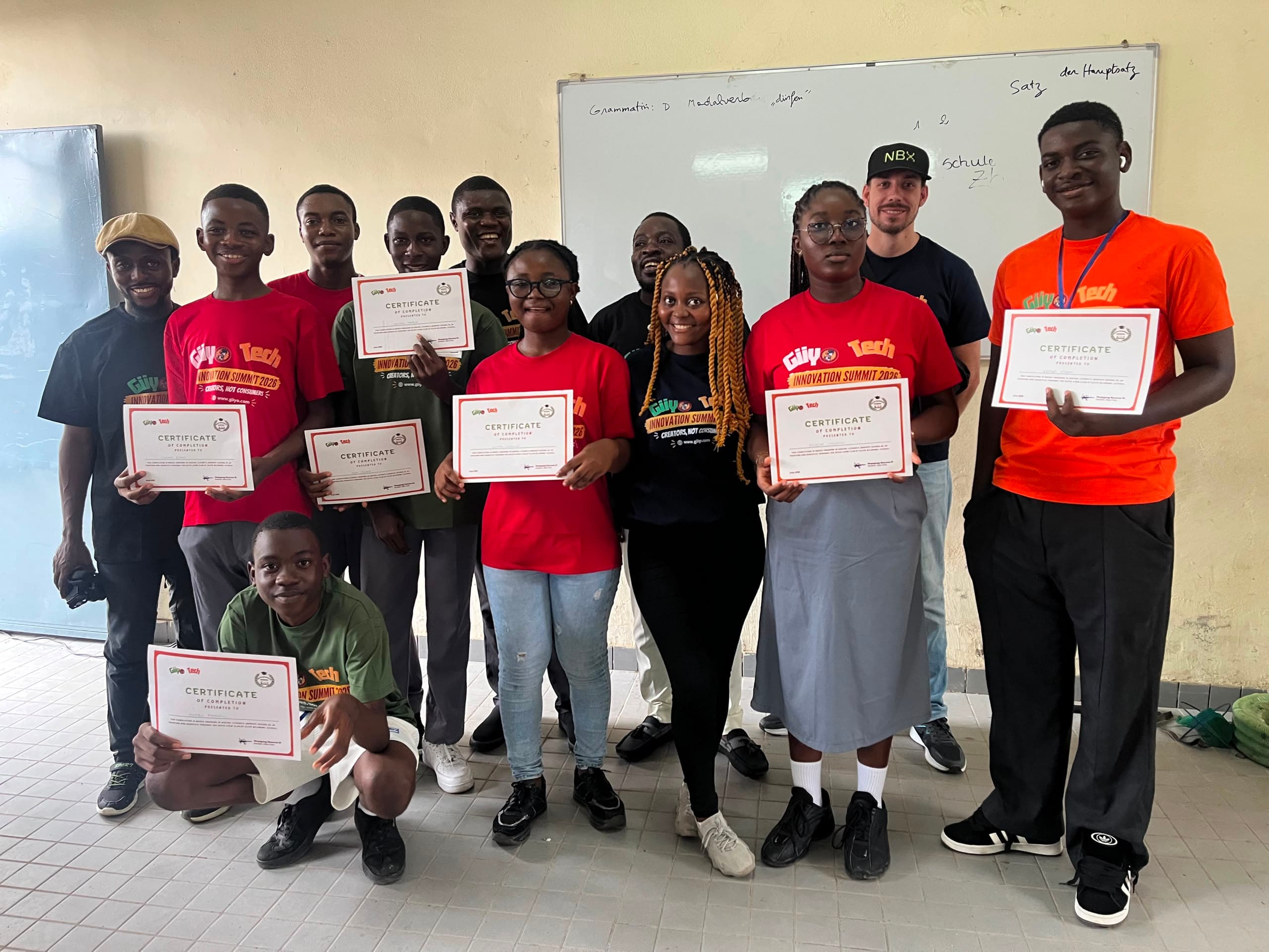Graduates hold their Certificates of Completion at the Giiyo Tech Innovation Summit 2026